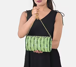 Shoulder bag with green beaded detailing, silk, and chain strap