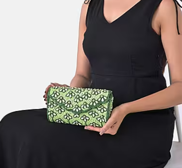 Shoulder bag with green beaded detailing, silk, and chain strap